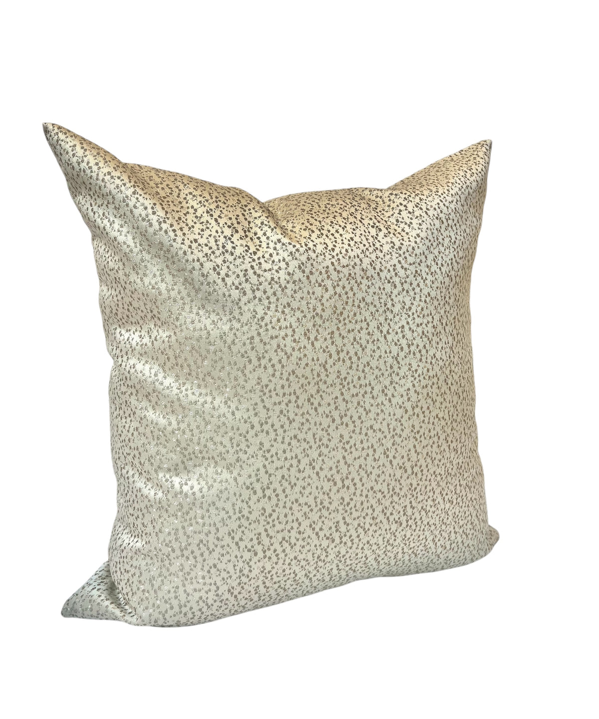 A square-shaped throw pillow with a silver speckled pattern on a beige background.