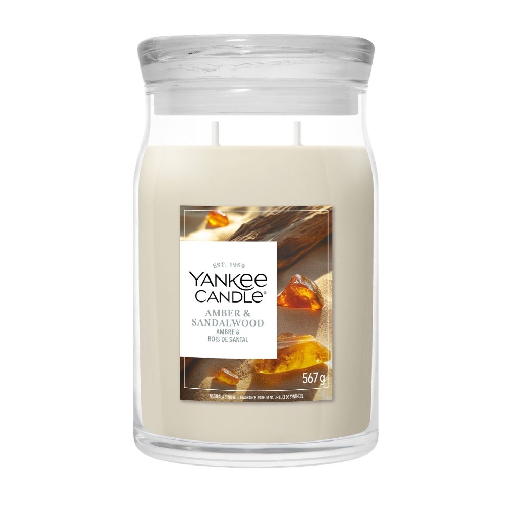 Yankee Candle Amber & Sandalwood candle in a glass jar on a white background