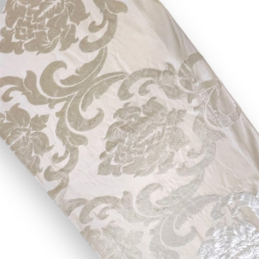 A beige runner with a floral patterned design.