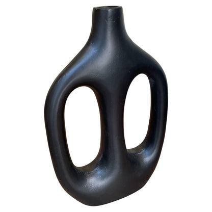 Black abstract vase on a white background