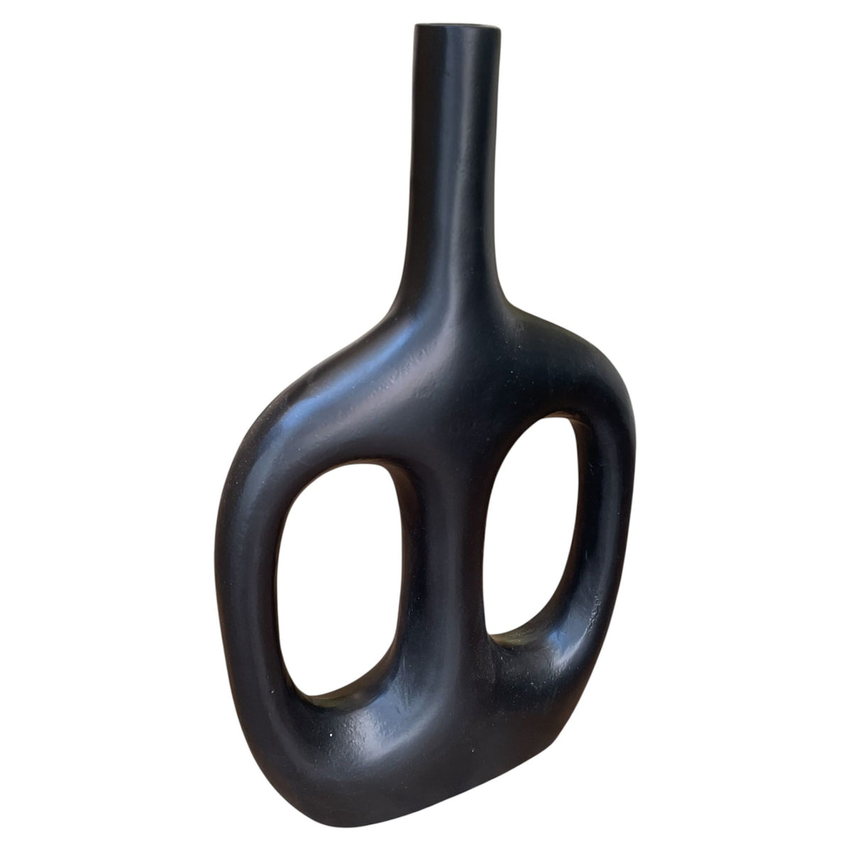 Black vase with unique design on a white background