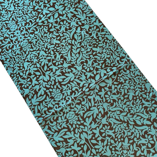 A table runner with a blue and brown floral pattern.