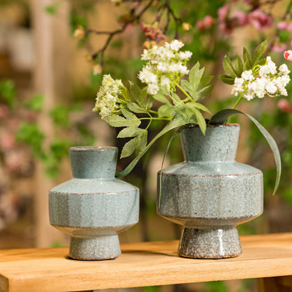Tall glossy ceramic vase featuring a gradient glaze transitioning from vibrant blue at the top to mossy green at the base.