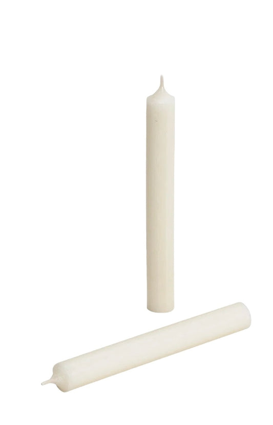 Vibrant Ivory wax taper candle standing upright against a white background.