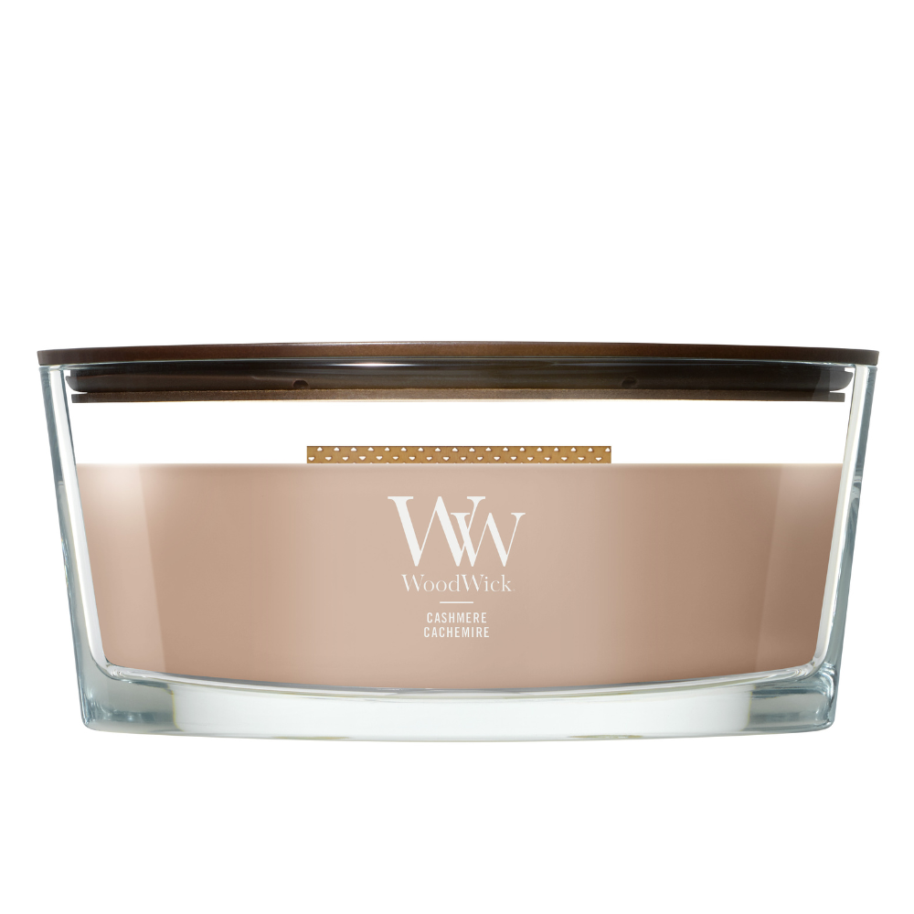WoodWick Cashmere candle in a clear glass vessel with a wooden lid.