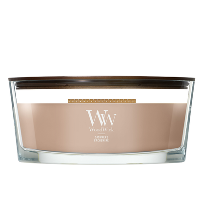 WoodWick Cashmere candle in a clear glass vessel with a wooden lid.