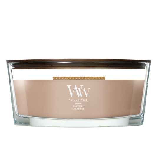 WoodWick Cashmere candle in a clear glass vessel with a wooden lid.