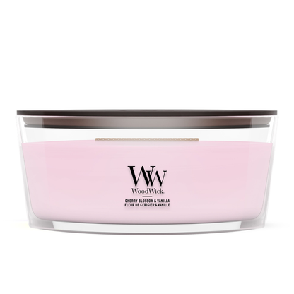 WoodWick Cherry Blossom & Vanilla candle in a clear glass jar with a wooden lid.