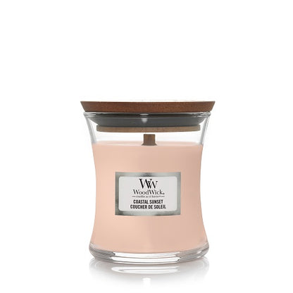 WoodWick candle in Coastal Sunset with a wooden lid on a white background