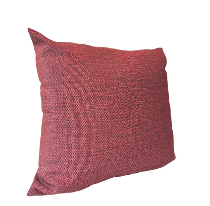 A rectangular crimson red textured pillow with a hidden pattern.