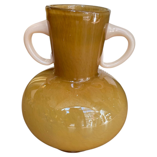 Yellow vase with white handles on a white background