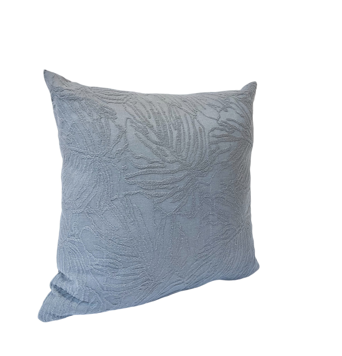 An embossed gray floral patterned pillow.