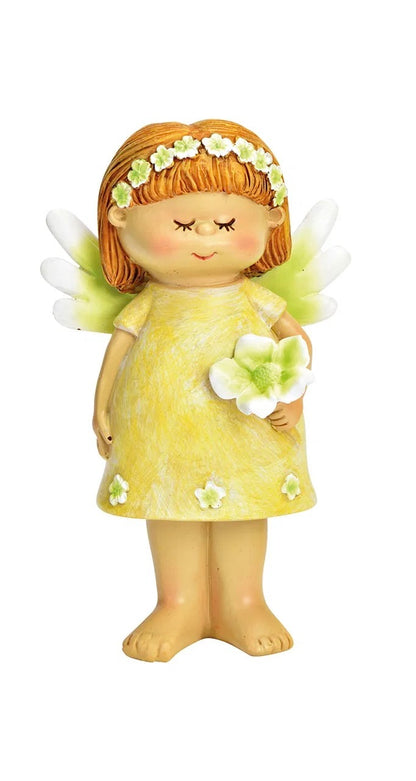 ceramic figurines of fairy,  in a yellow dress with a green flower.