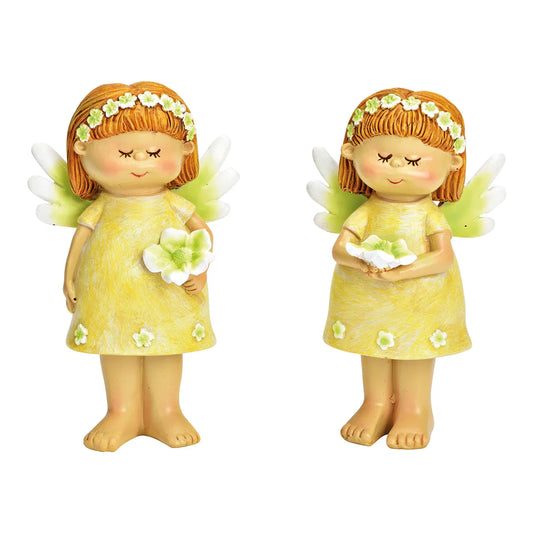 Two ceramic figurines of fairies, one in a yellow dress with a green flower, and the other in a green dress with a yellow flower.