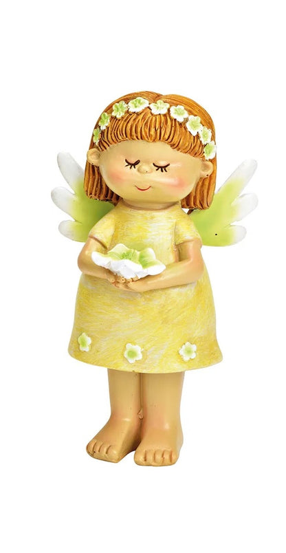 ceramic figurines of fairy,  in a green dress with a white/grreen flower.