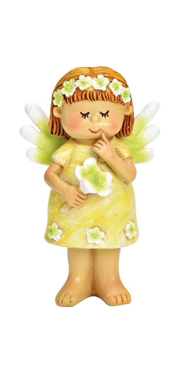 ceramic figurines of fairy,  in a green dress with a white/grreen flower.