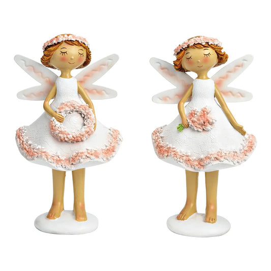 Two ceramic figurines of fairies in white and pink colors, each holding a small floral wreath.