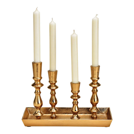 A gold candle holder with four candles, designed for holding tea lights.