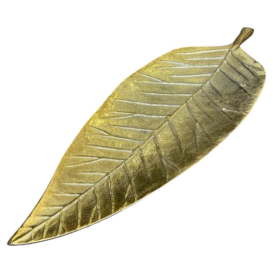 Gold leaf-shaped object on a white background