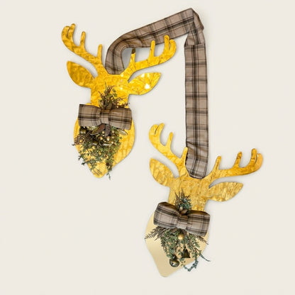 gold metallic deer hanger against white off background