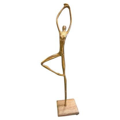 Gold metal human stand figure posed on wooden base