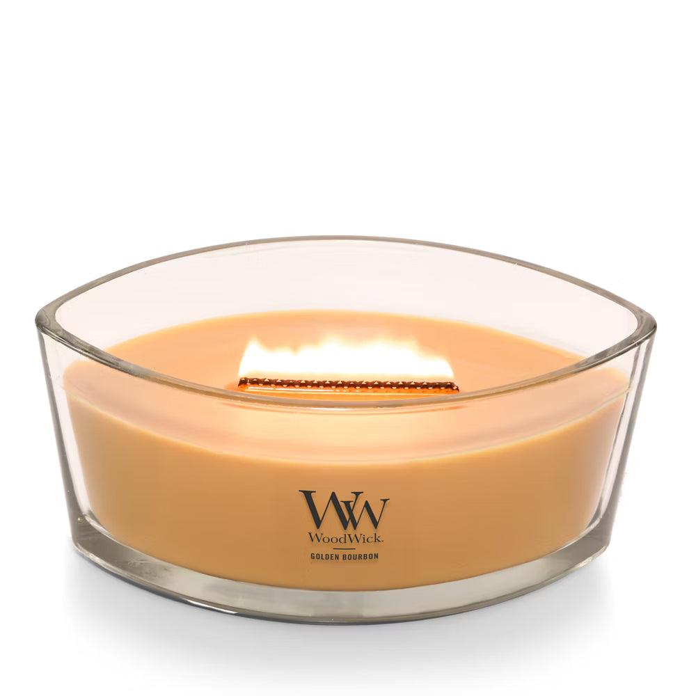 WoodWick Golden Bourbon candle in a clear glass jar with an open lid