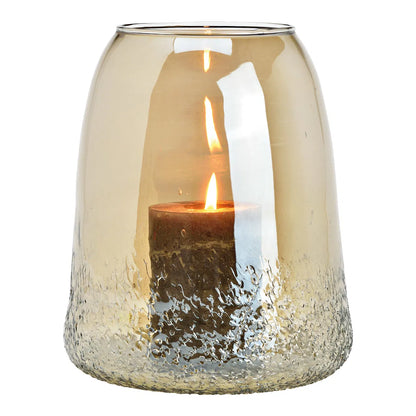 A beige glass candle holder with a frosted pattern, containing a candle, with a clear glass top.