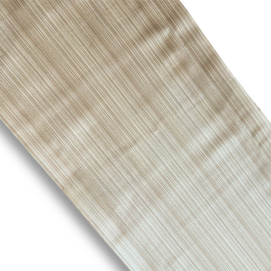 Close-up of a wooden surface with a light brown and gray striped pattern