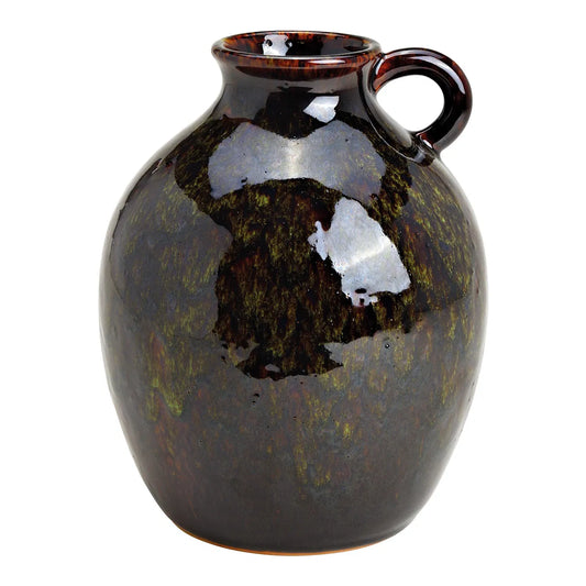 A ceramic vase with a glossy green and brown finish, featuring a handle.