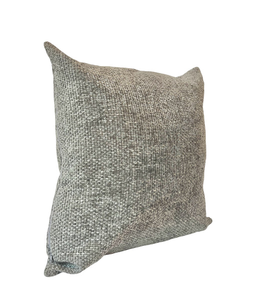 A square-shaped throw pillow with a textured pattern,  in a grey color.