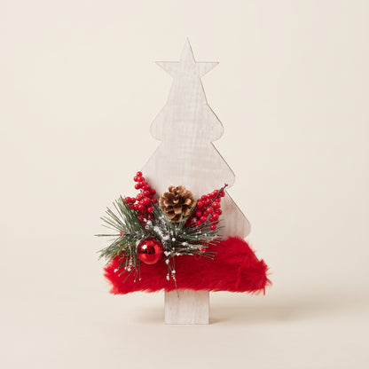 Handmade wooden star Christmas tree centerpiece decorated with pine branches, pinecones, and a red holiday ornament.