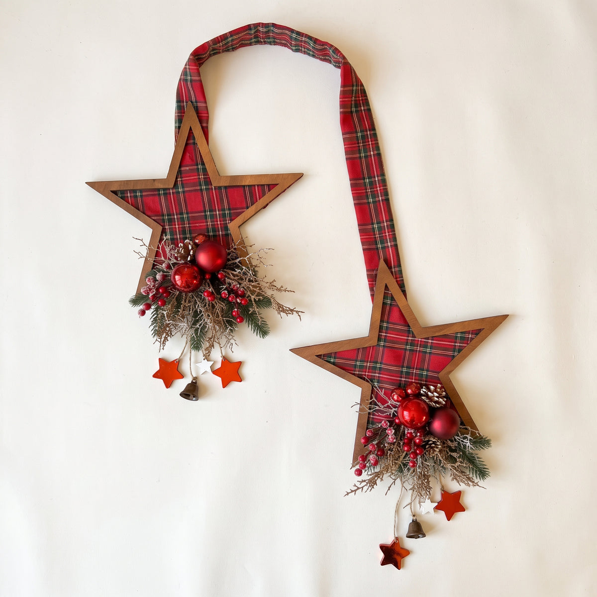 Handmade red plaid double-sided star hanger for Christmas front door decor, designed by Inas against white background