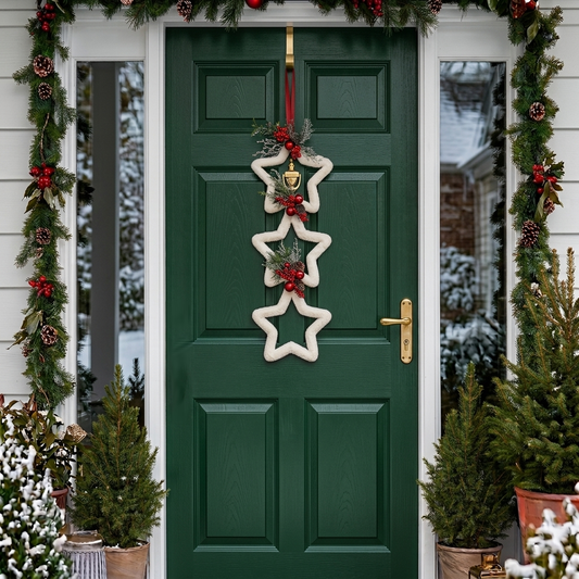 Handmade triple connected star hanger featuring a double-sided design on a dark green front door with festive holiday greenery, designed by Inas.