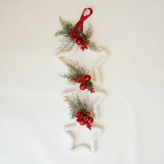 Handmade triple connected star hanger  for christmas against a white background, designed by Inas