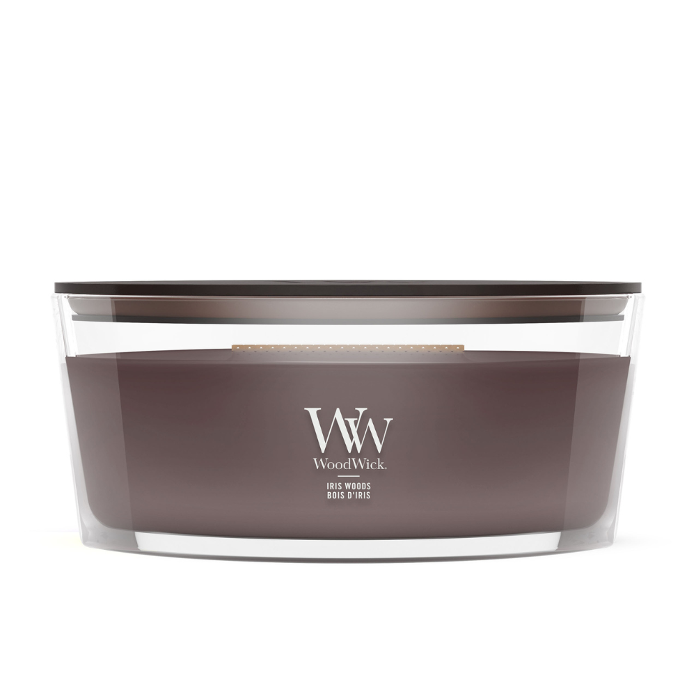 WoodWick Iris Woods ellipse candle in a clear glass jar with a wooden lid.