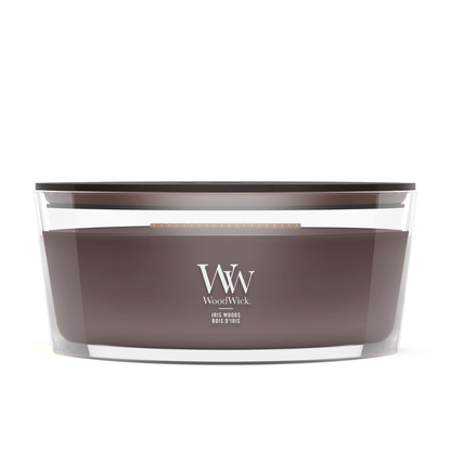 WoodWick Iris Woods ellipse candle in a clear glass jar with a wooden lid.