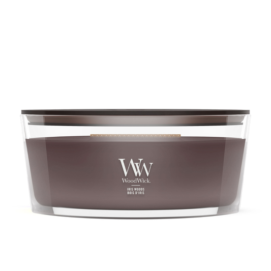 WoodWick Iris Woods ellipse candle in a clear glass jar with a wooden lid.