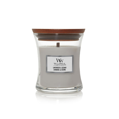 WoodWick candle with wooden lid on a white background