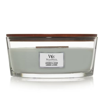 WoodWick Lavender & Cedar Ellipse Jar Candle with light sage green wax, a wooden wick, and a wooden lid centered against a clean white background.