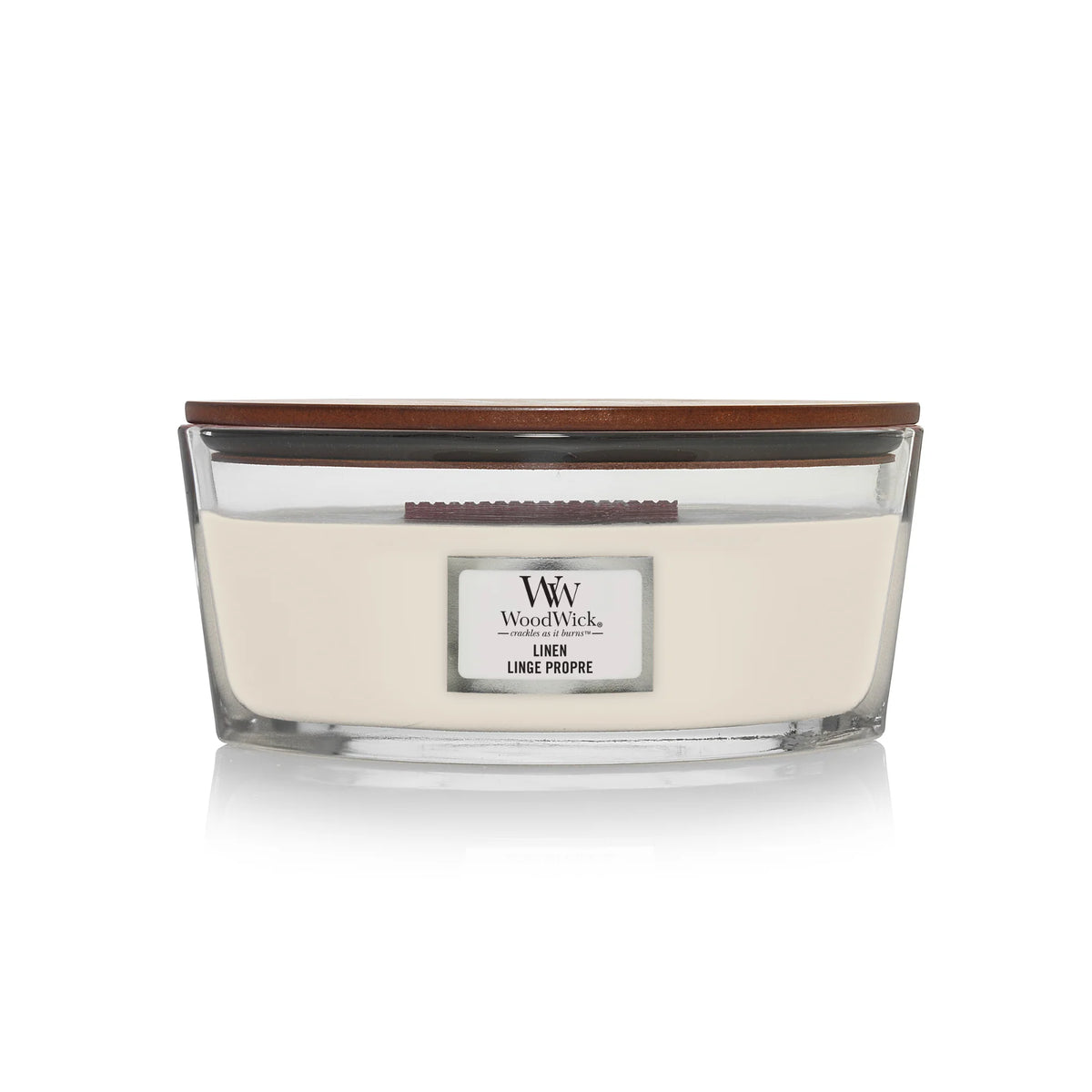WoodWick Linen ellipse candle in a clear glass jar with a wooden lid.