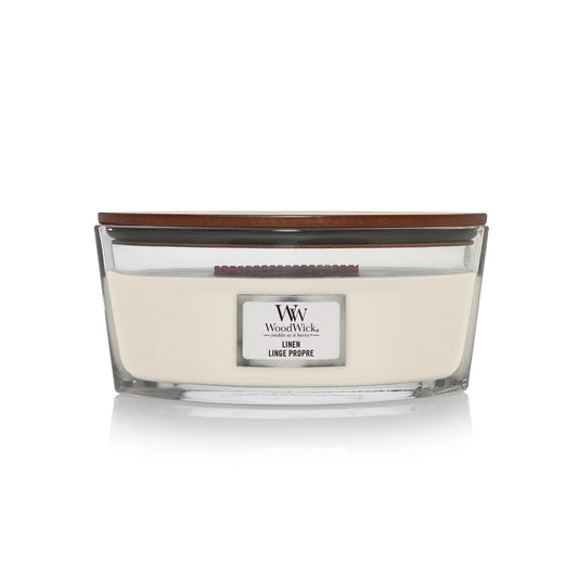 WoodWick Linen ellipse candle in a clear glass jar with a wooden lid.