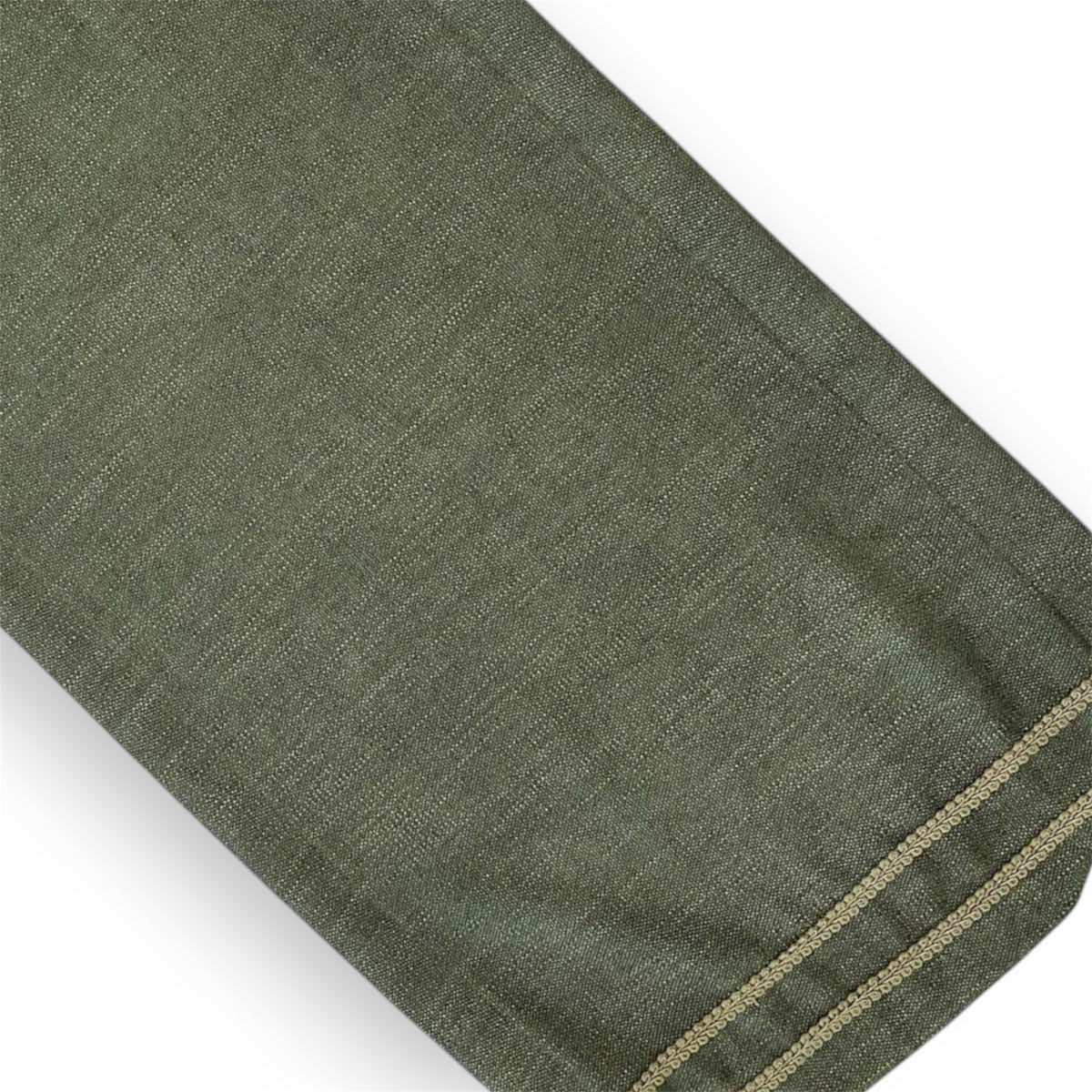 Olive green linen table runner with a visible green zipper.