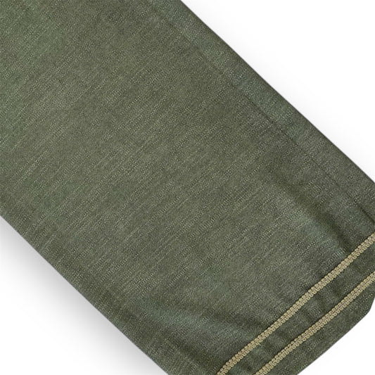 Olive green linen table runner with a visible green zipper.