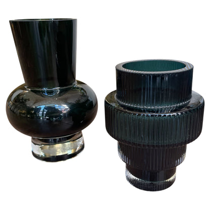 Two black glass vases on a white background