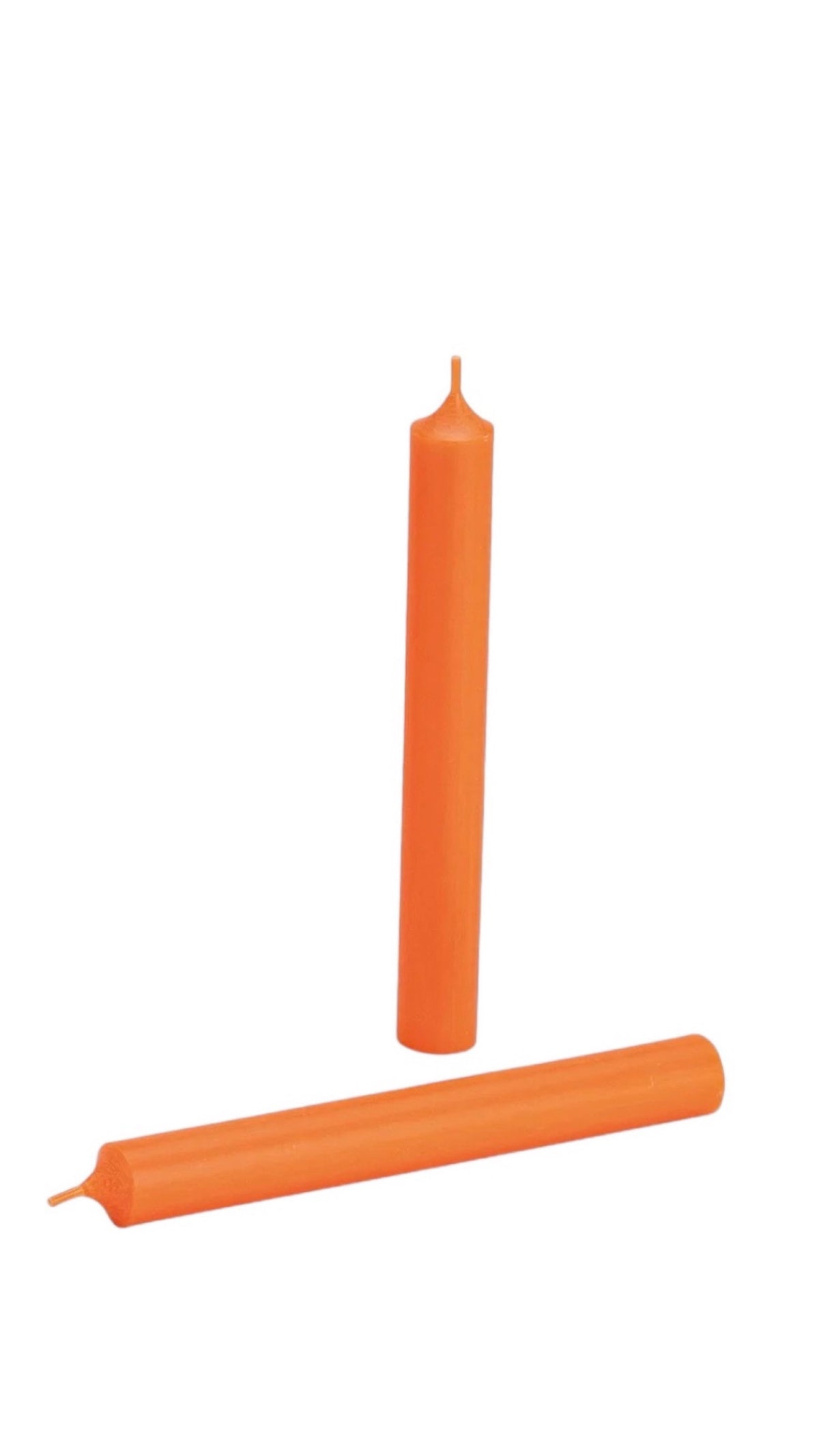 Vibrant orange wax taper candle standing upright in a beige ribbed ceramic holder against a dark background.
