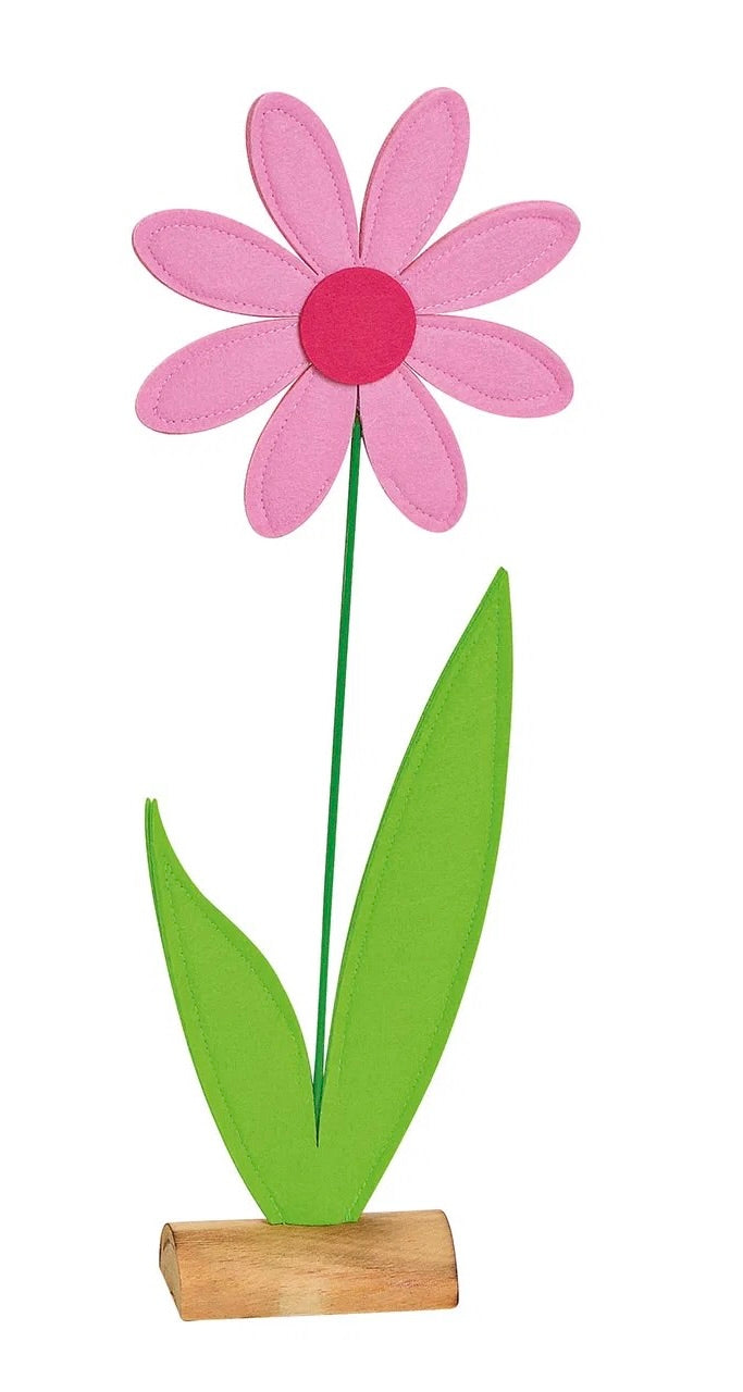 Artificial flower with Pink petals respectively, on wooden stand.