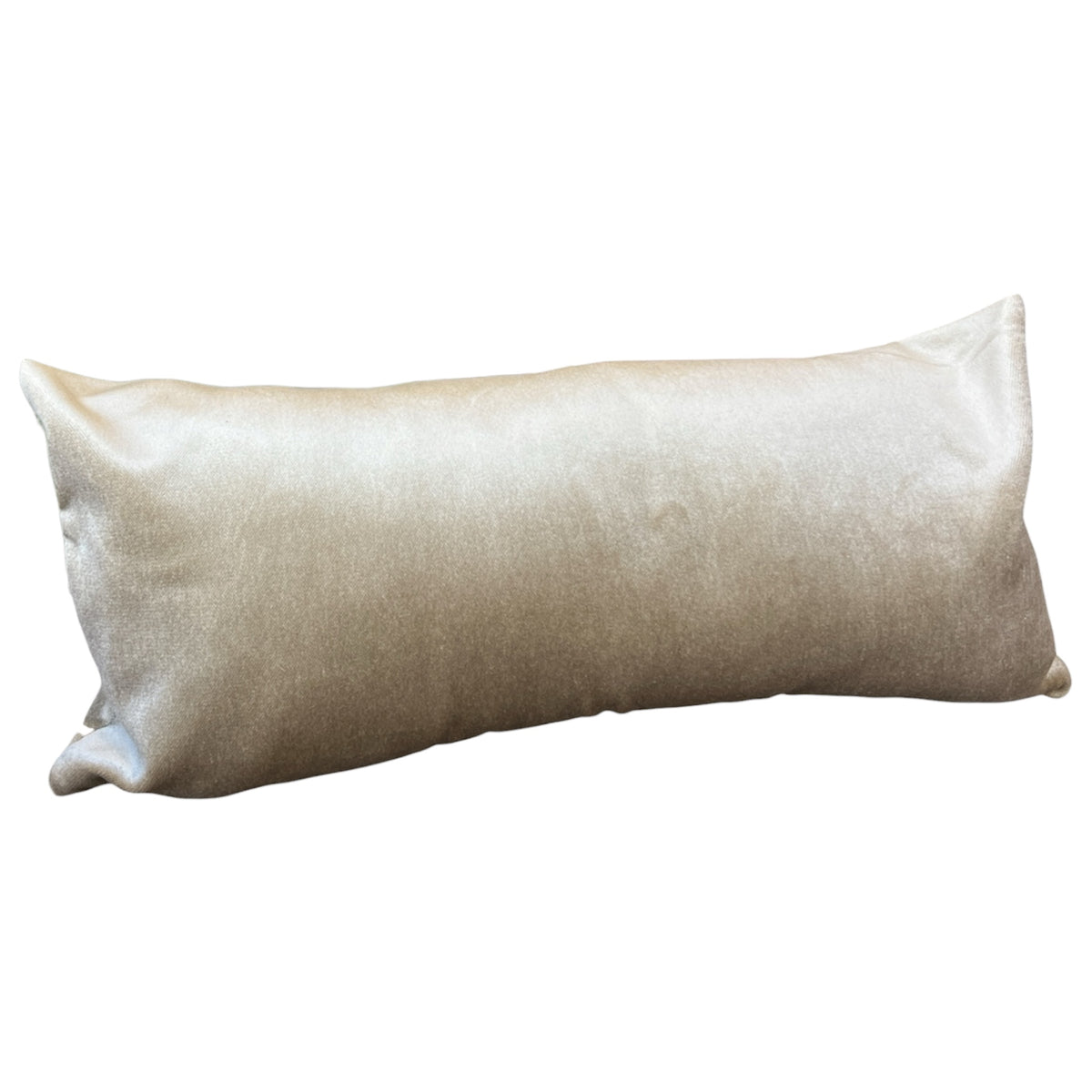 A rectangular lumbar pillow in a textured champagne beige fabric, shown against a plain white background.