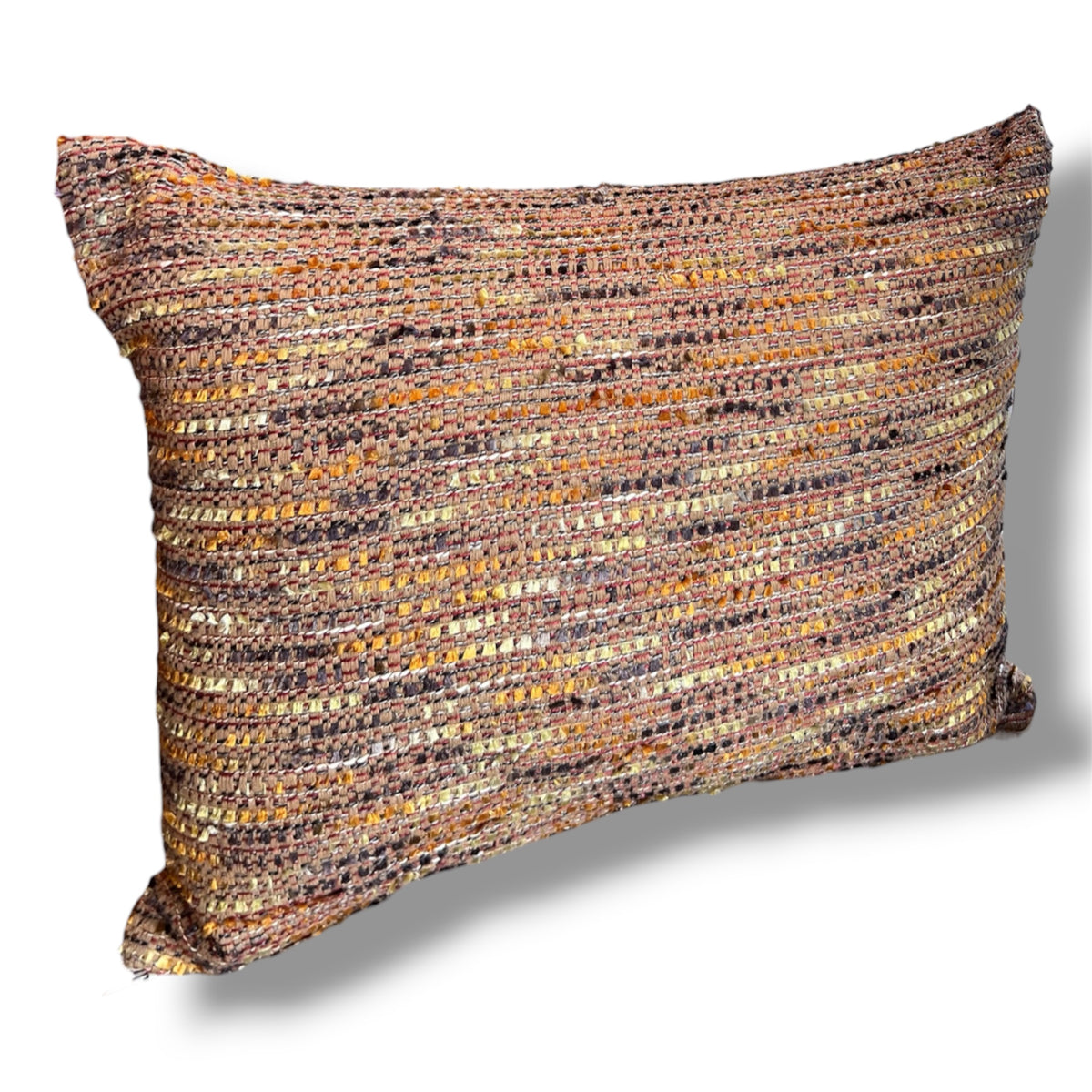Rectangular decorative throw pillow in a rich, multi-colored tweed weave featuring woven threads of terracotta, ochre yellow, brown, and soft purple against a plain white background.