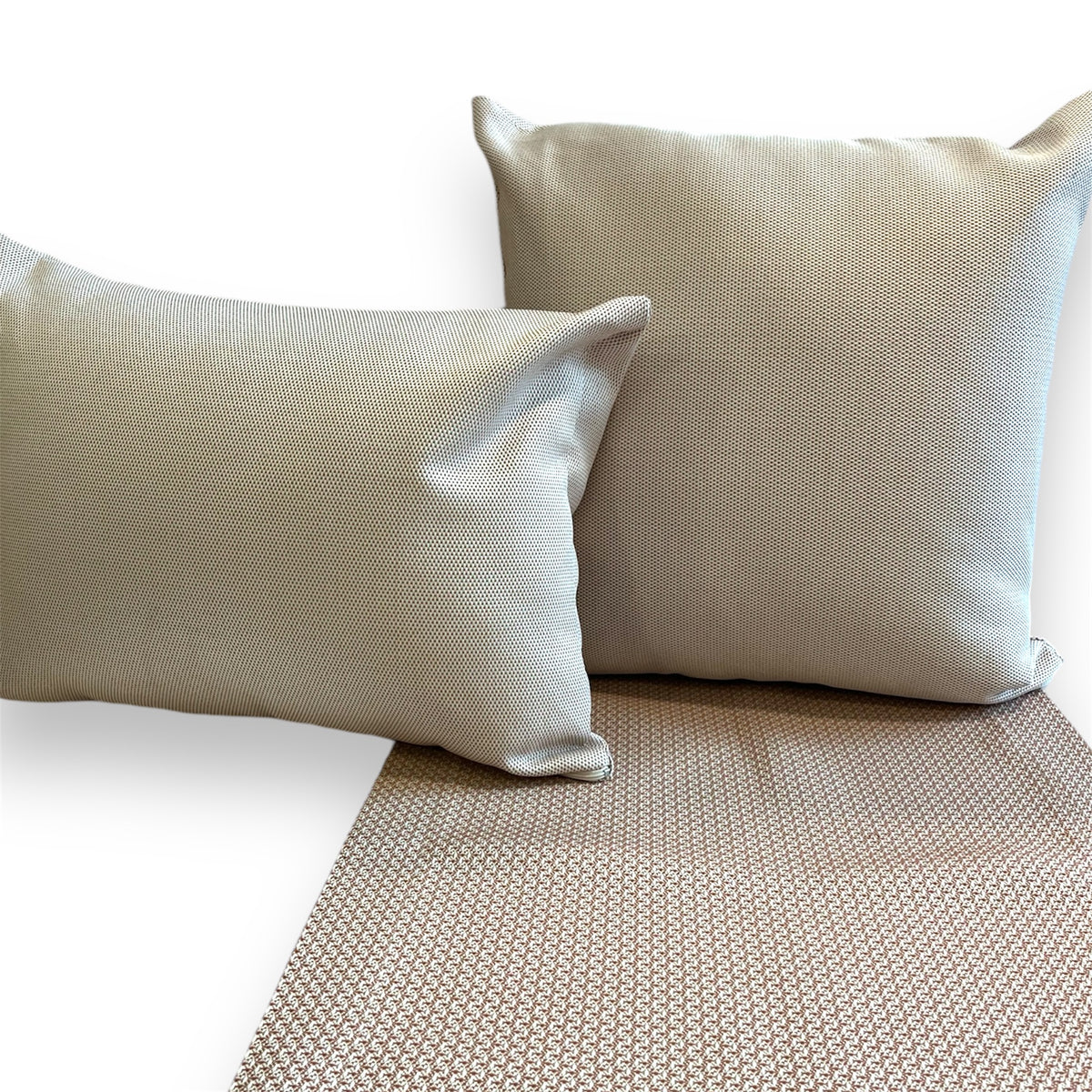 Rectangular and a square geometric pattern pillow with thier runner