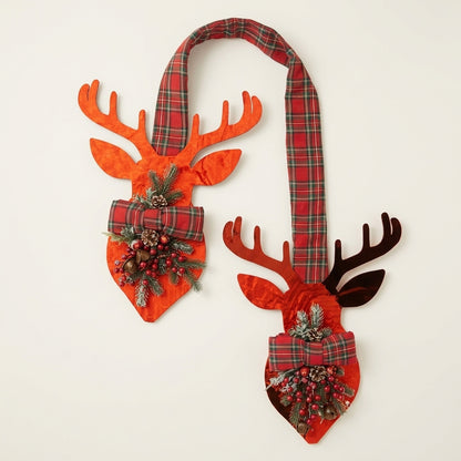 Red metallic deer hanger against white off background